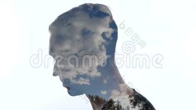 忧郁的人和天空中的云的肖像-双重论述